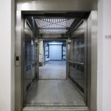 Open doors of the through-car of a Doppler Stainless steel ECO 2 i MRL elevator